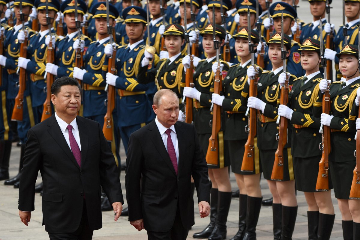 <i>Greg Baker/Pool/AFP/Getty Images</i><br/>Chinese President Xi Jinping and Russian leader Vladimir Putin review a military honor guard outside the Great Hall of the People in Beijing on June 8