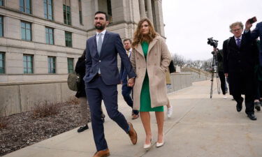 A lawyer for Iowa Senate hopeful Abby Finkenauer urged the state Supreme Court on Wednesday to place her back on this year's Democratic primary ballot. Finkenauer is shown here leaving the state Supreme Court building in Des Moines with her husband