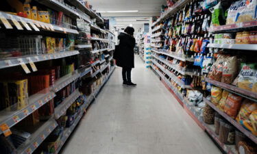 People shop in a store in Brooklyn on March 10 in New York City. The price of gas