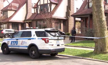 Police investigated at the Queens home of a 51-year-old woman whose body was found a half-mile away in a duffel bag.