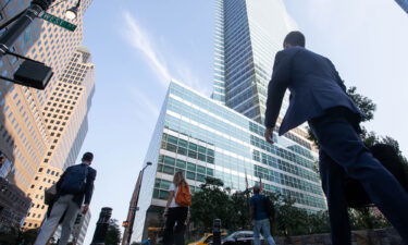 Office workers walk near the Goldman Sachs Group Inc. headquarters in New York