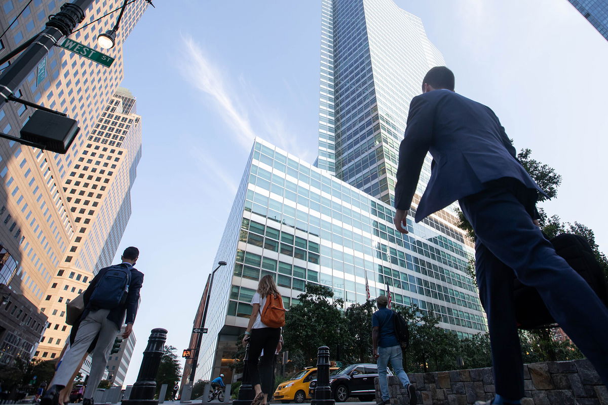 <i>Michael Nagle/Bloomberg/Getty Images</i><br/>Office workers walk near the Goldman Sachs Group Inc. headquarters in New York