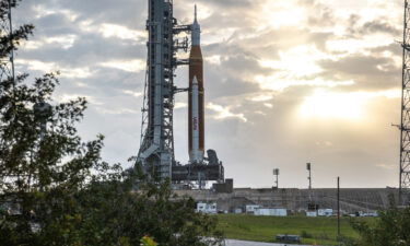 Blue sky and clouds serve as the backdrop for a sunrise view of the Artemis I Space Launch System (SLS) and Orion spacecraft at Launch Pad 39B at NASA's Kennedy Space Center in Florida on March 23.