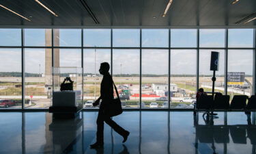 A traveler walks through the George Bush Intercontinental Airport on December 03