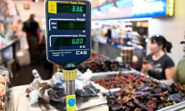 A clerk weighs dried peppers for a customer inside Grand Central Market on March 11 in downtown Los Angeles