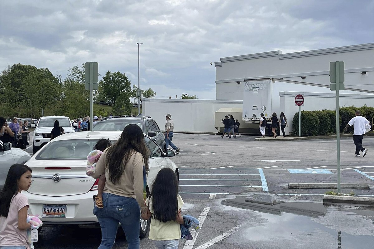 <i>Justin Smith/AP</i><br/>People walk through a parking lot at the Columbiana Centre mall in Columbia