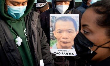 A press conference and memorial vigil is held for Yao Pan Mo on the street corner where he was beaten