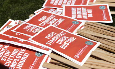 Picket signs are seen during the "Fight Starbucks' Union Busting" rally in Seattle on April 2. The US labor board is suing Starbucks to rehire unionizing employees.