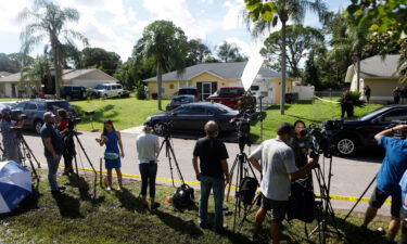 Members of the media wait near the Florida home of Brian Laundrie