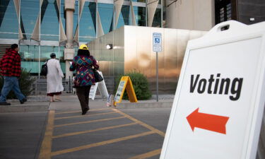 Voters enter Burton Barr Central Library to cast their ballots on November 3