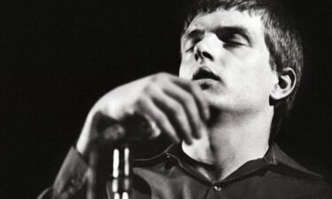 Joy Division frontman Ian Curtis performing onstage before his death in 1980.