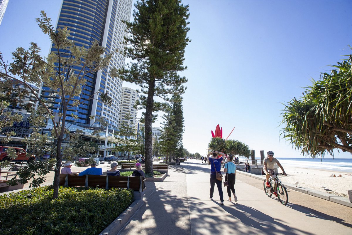 <i>Jono Searle/Getty Images</i><br/>People walk along the Esplanade at Surfers Paradise in Gold Coast