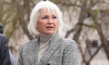 Mesa County (Colo.) Clerk Tina Peters talks to well-wishers at a rally staged to voice concerns about free and fair elections on the west steps of the State Capitol on April 5