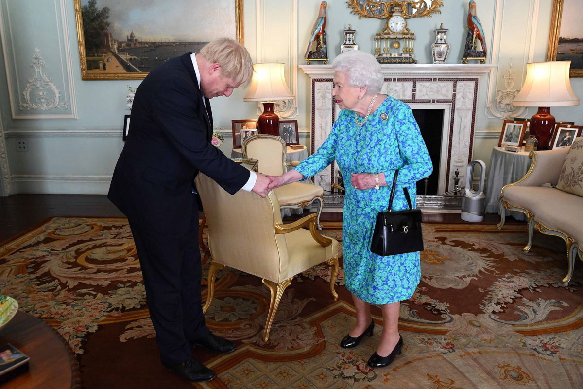 <i>Victoria Jones/Pool/AFP/Getty Images</i><br/>Britain's Queen Elizabeth II welcomes Johnson