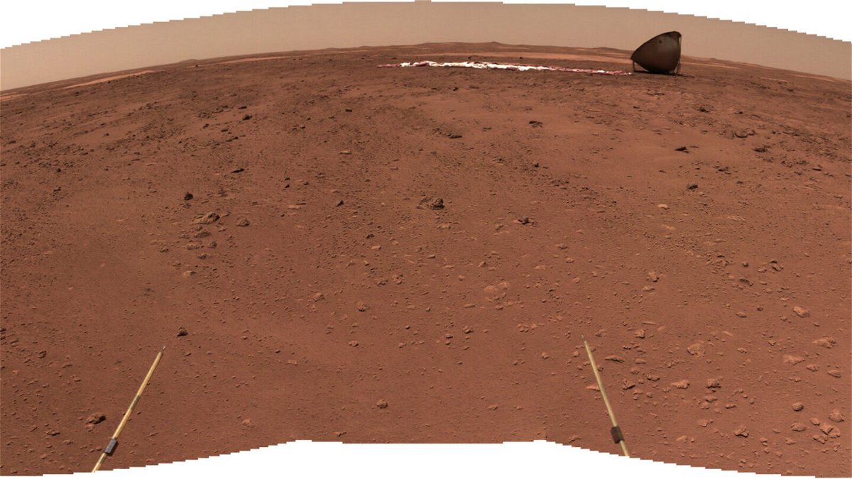 <i>CNSA</i><br/>This perspective shows the discarded heat shield of the lander in the background of the landing site.