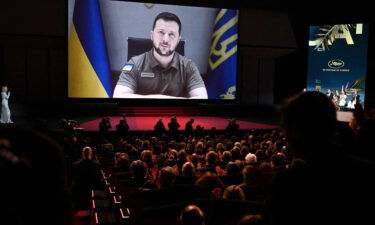 Ukrainian President Volodymyr Zelensky addresses guests during the opening ceremony of the Cannes Film Festival on May 17.