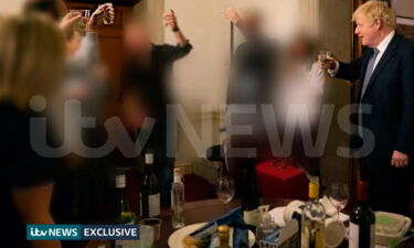 Another of the images shows several bottles on the table in front of Johnson and his colleagues.