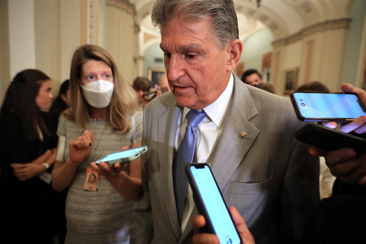 <i>Chip Somodevilla/Getty Images</i><br/>Sen. Joe Manchin talks to reporters as he leaves the the Senate Democrats weekly policy luncheon at the U.S. Capitol on July 20
