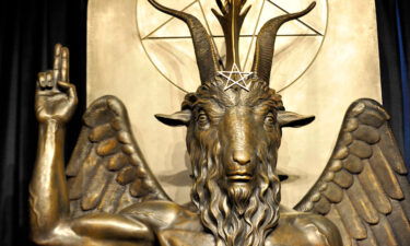 The Baphomet statue is seen in the conversion room at the Satanic Temple where a "Hell House" was held in Salem