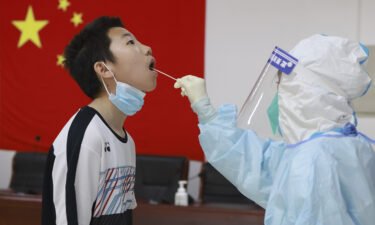 A boy receiving a Covid test in Beijing