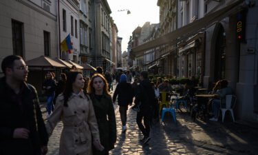People wander the cobbled streets on April 30