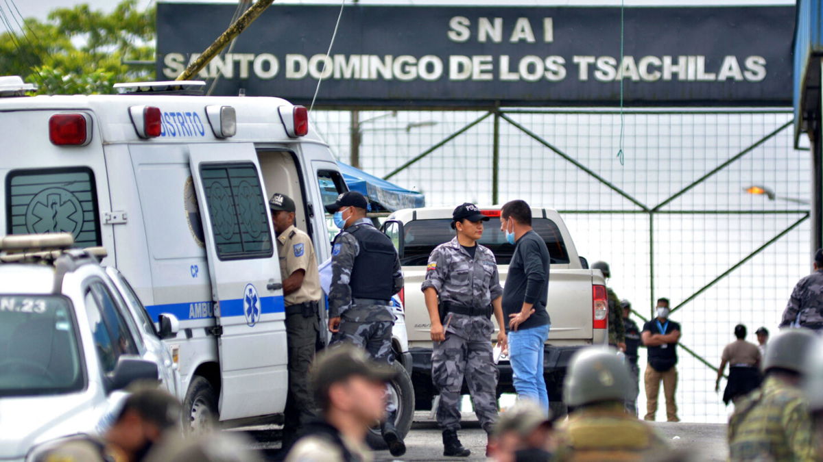 <i>JUAN CARLOS PEREZ/AFP via Getty Images</i><br/>Security forces stand outside the prison in Santo Domingo de los Tsáchilas