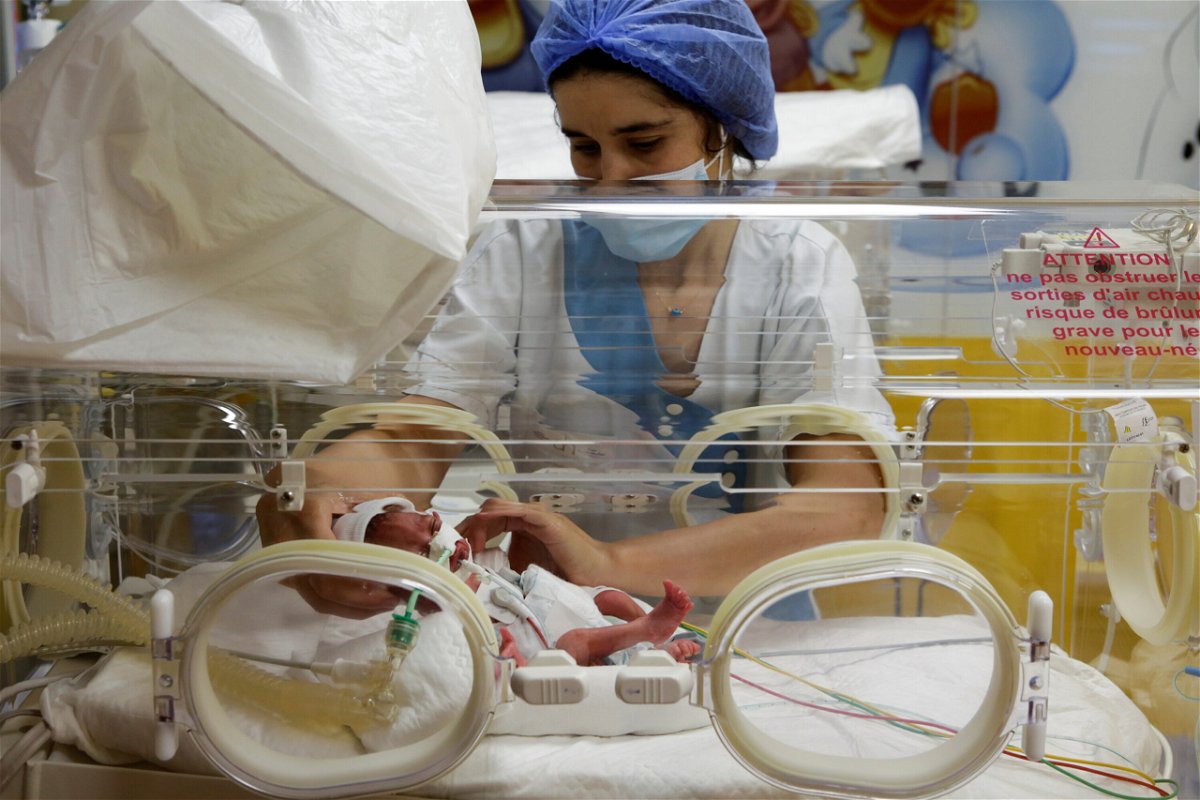 <i>Youssef Boudlal/Reuters</i><br/>A nurse takes care of one of the newborn nonuplets