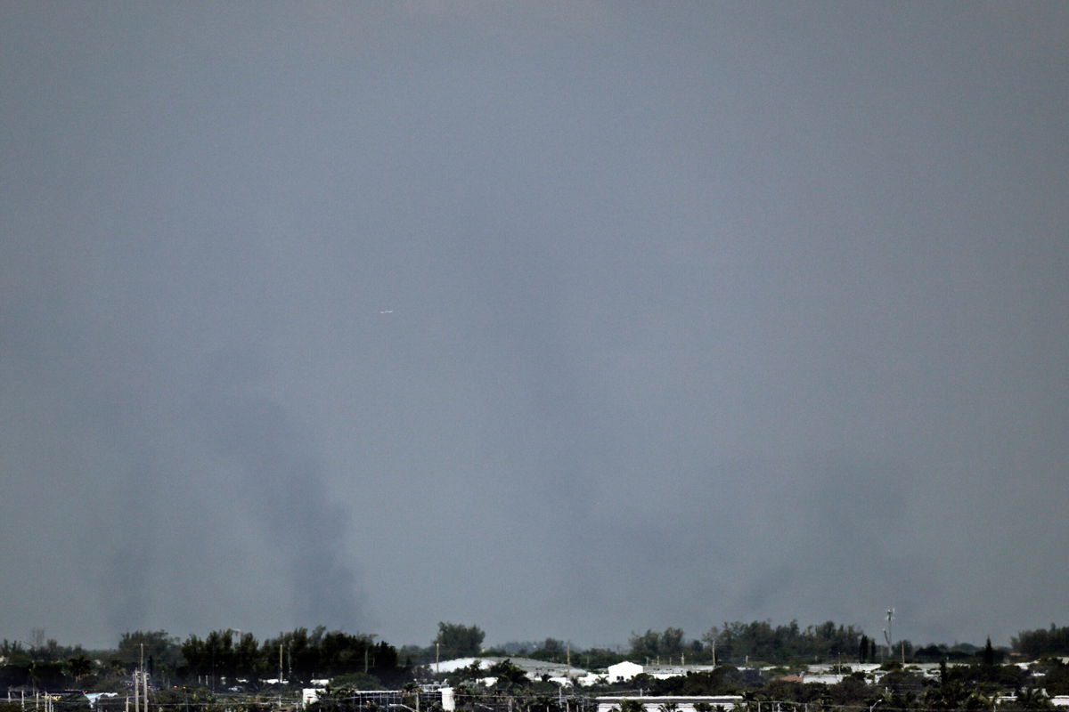 <i>Amy Beth Bennett/AP</i><br/>Smoke rises from wildfires near Weston on May 5