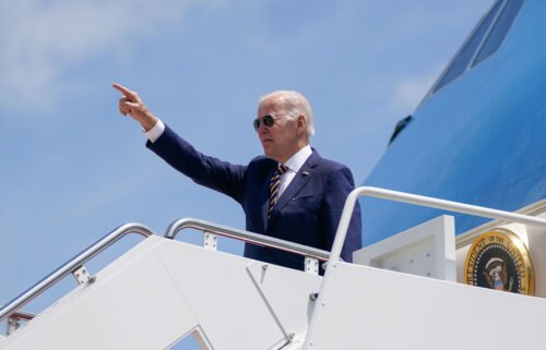 President Joe Biden gestures as he boards Air Force One for a trip to South Korea and Japan on May 19