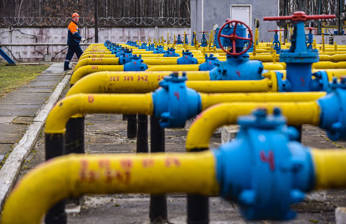 <i>Mykola Tys/SOPA Images/LightRocket/Getty Images</i><br/>Gas station worker walks near gas pipes at a natural gas station during the installation of complex gas preparation at the Ukrgasvydobuvannya UCPG facility.