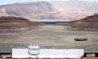 Two sets of human remains have been discovered recently as Lake Mead continues to recede. A formally sunken boat rests on a section of dry lakebed along drought-stricken Lake Mead on May 9