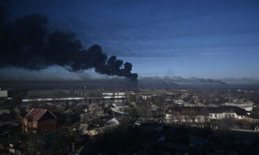 Black smoke rises from a military airport in Chuguyev near Kharkiv on February 24.