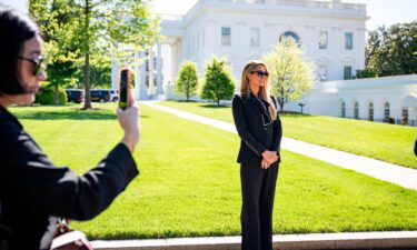 Actress and model Paris Hilton stands outside the White House on May 10 in Washington. Hilton met with officials at the White House during a trip aimed at her ongoing advocacy against child abuse.