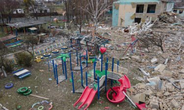 A damaged playground is seen next to the Barvinok kindergarten building in Makariv
