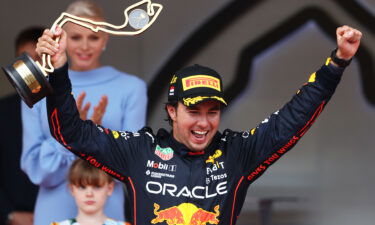 Race winner Sergio Pérez celebrates on the podium in Monte Carlo