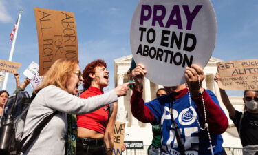 Pro-choice activists object to a pro-life supporter trying to provoke arguments at the Supreme Court the day after learning that Supreme Court justices had voted to overturn Roe v. Wade in a draft opinion for the Dobbs v. JWHO case.