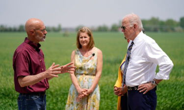 President Joe Biden listens as O'Connor Farms owner Jeff O'Connor