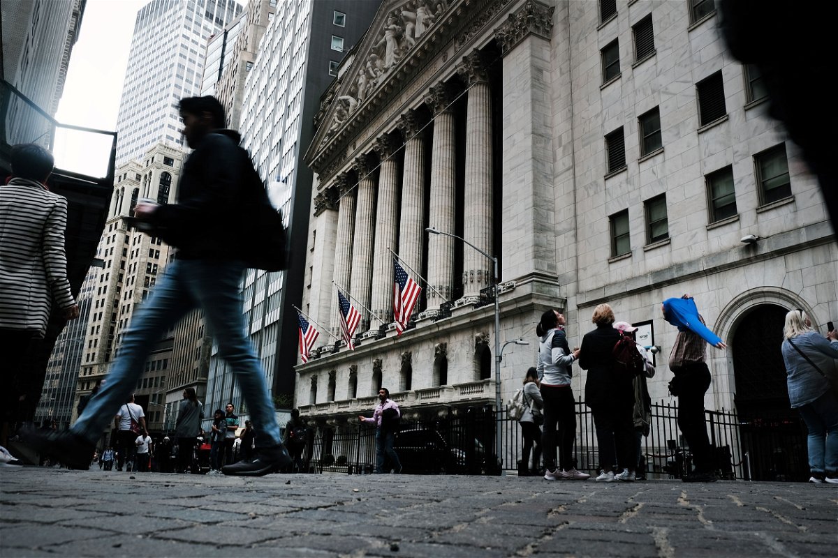 <i>Spencer Platt/Getty Images</i><br/>The Dow fell more than 400 points shortly after the opening bell. People walk by the New York Stock Exchange on May 05