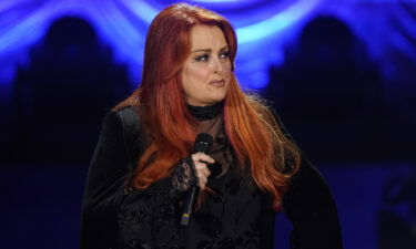 Wynonna Judd speaks during a tribute to her mother