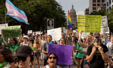 Protesters march from the Capitol to the United States Federal Courthouse to rally for abortion rights in Austin
