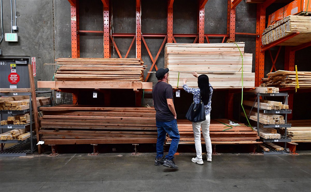 <i>Frederic J. Brown/AFP/Getty Images</i><br/>People shop for lumber at a Home Depot store in Alhambra