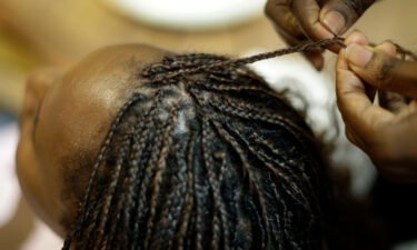 Shelly Smith braids hair at her salon