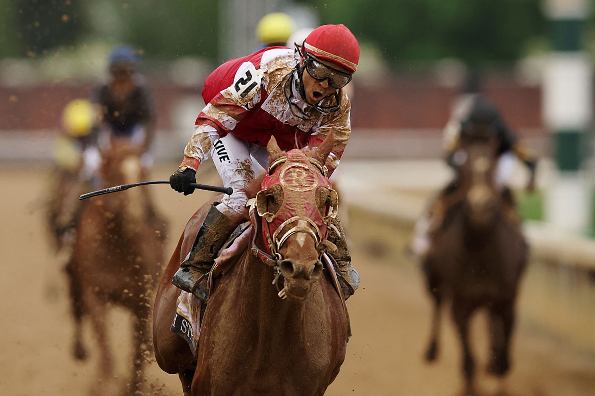 <i>Ezra Shaw/Getty Images</i><br/>Jockey Sonny Leon reacts as Rich Strike wins the 148th running of the Kentucky Derby at Churchill Downs on May 07