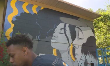 Community members got together at the Hagginwood Community Center to put the finishing touches on the final community mural of the year.