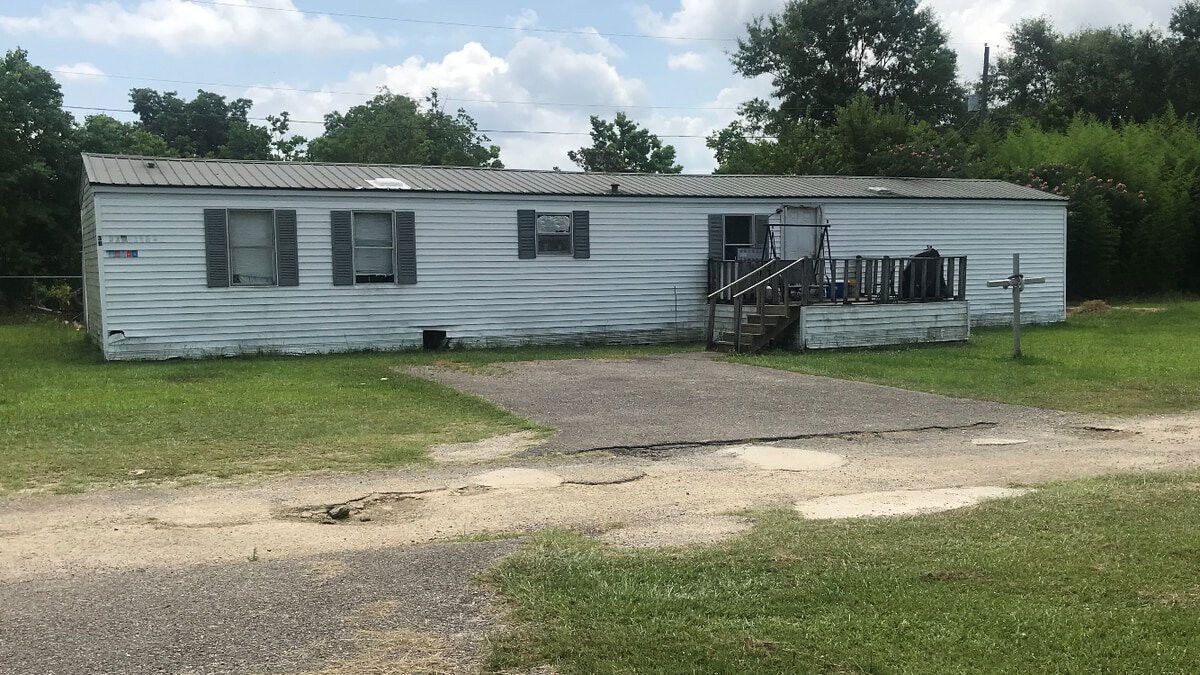 <i>Daeshen Smith/WALA</i><br/>A 3-year-old boy was shot and killed when a 13-year-old boy was playing with a loaded gun at this home in Grand Bay