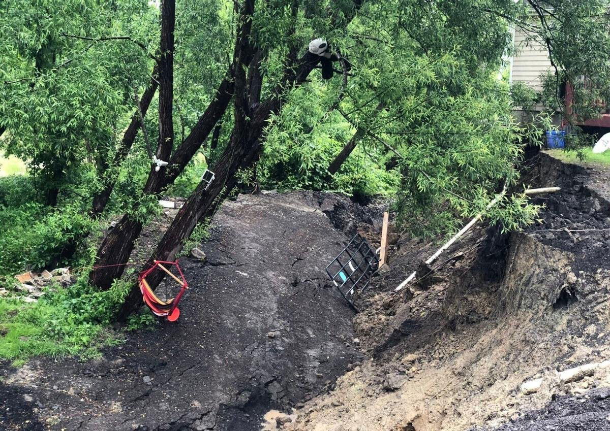 <i>Minh Connors/Buffalo News</i><br/>A landslide from Wednesday afternoon caused the house at 7620 Tonawanda Creek Road in Royalton to be condemned.