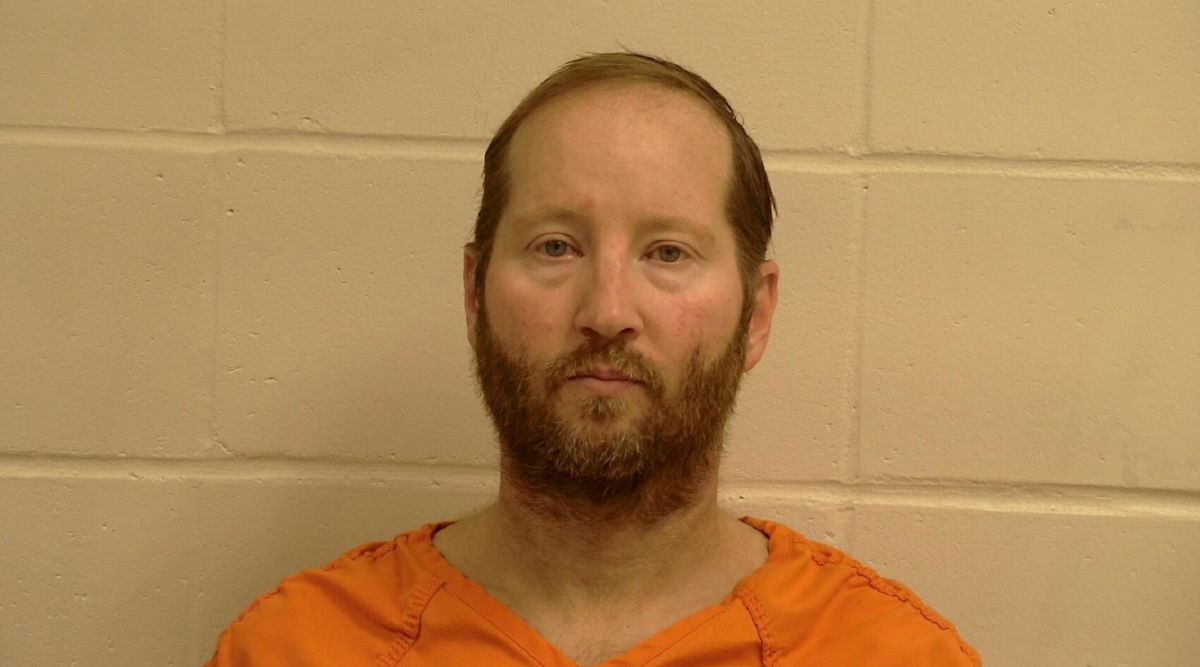 <i>Pennington County</i><br/>Eric Reinbold who was charged for fatally stabbing his wife is accused of assaulting corrections officers during an attempted escape from jail.