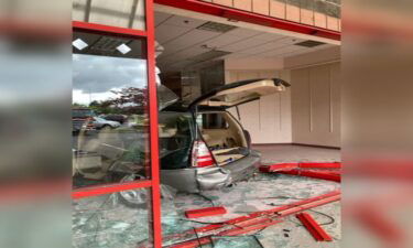 Shards of glass and a boarded-up storefront are the remnants of a wild