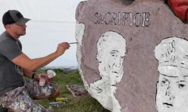 Bubba Sorensen is painting the 100th rock in the Freedom Rock series.