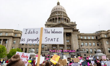 An attendee at a rally for abortion rights holds a sign outside the Idaho Statehouse in downtown Boise on May 14.